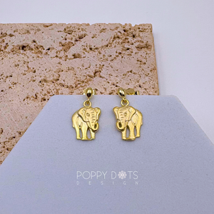 A pair of sterling silver gold-plated elephant stud earrings displayed on a grey and beige card.