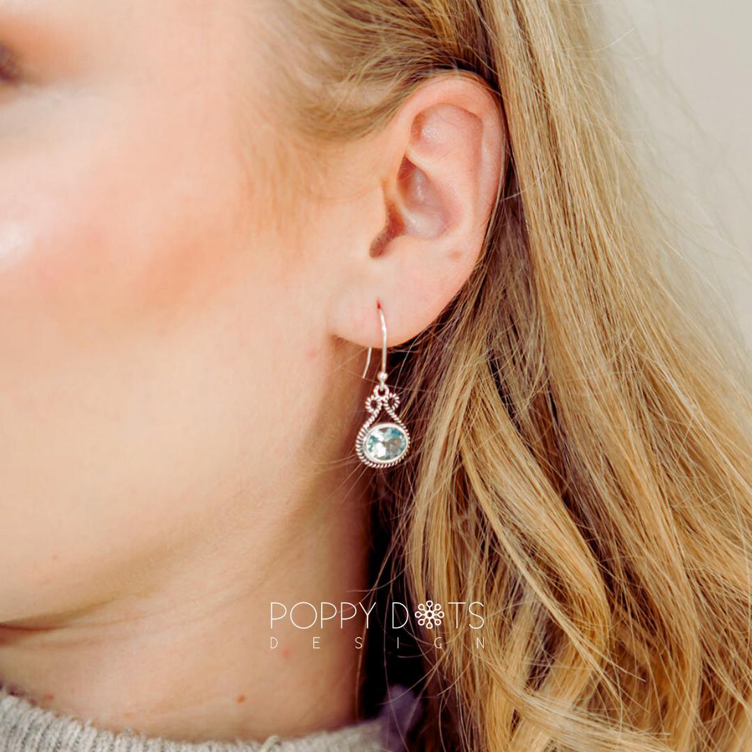 Sterling Silver Bow Blue Topaz Oval Earrings