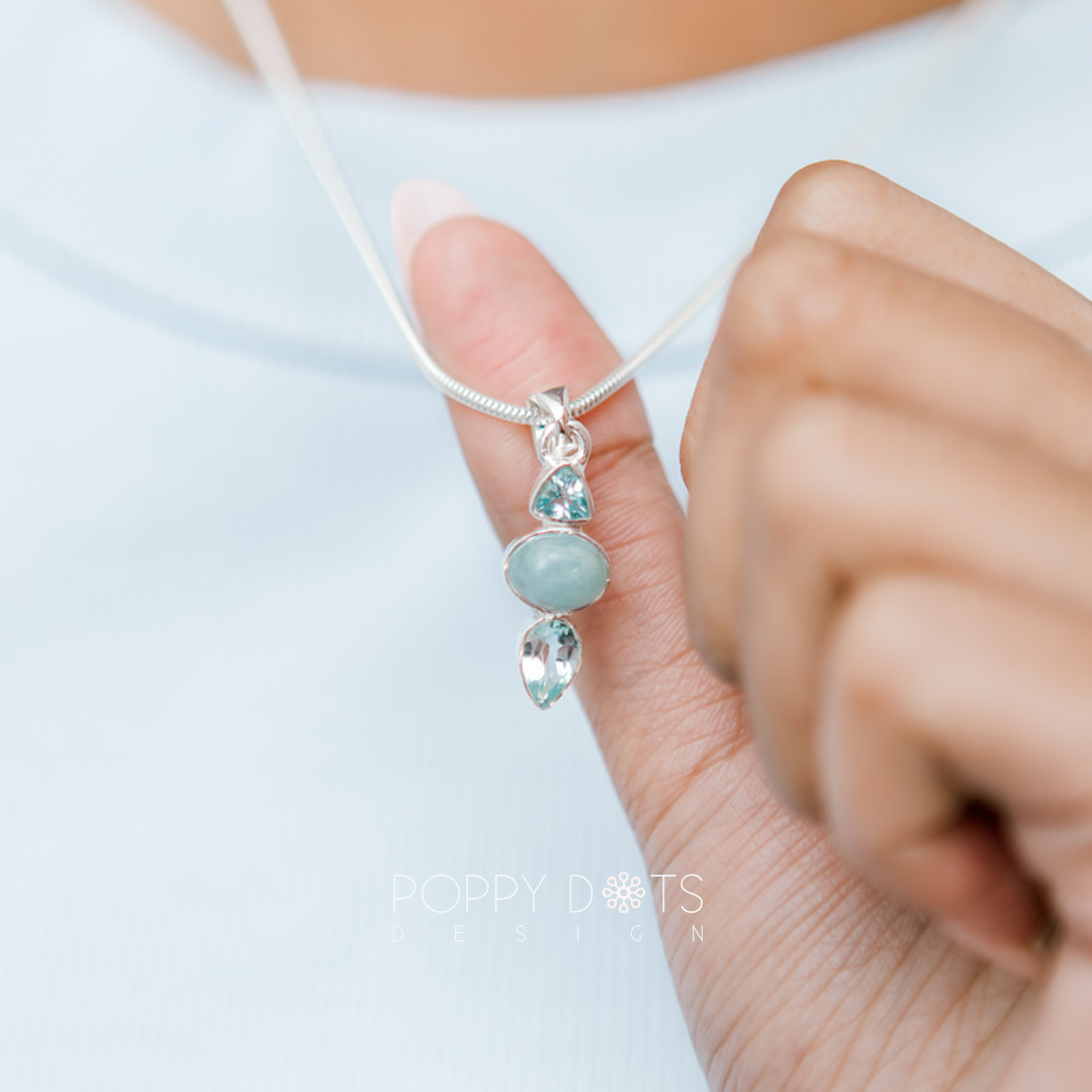 Luxurious Sterling Silver Blue Topaz Earrings and Pendant Set