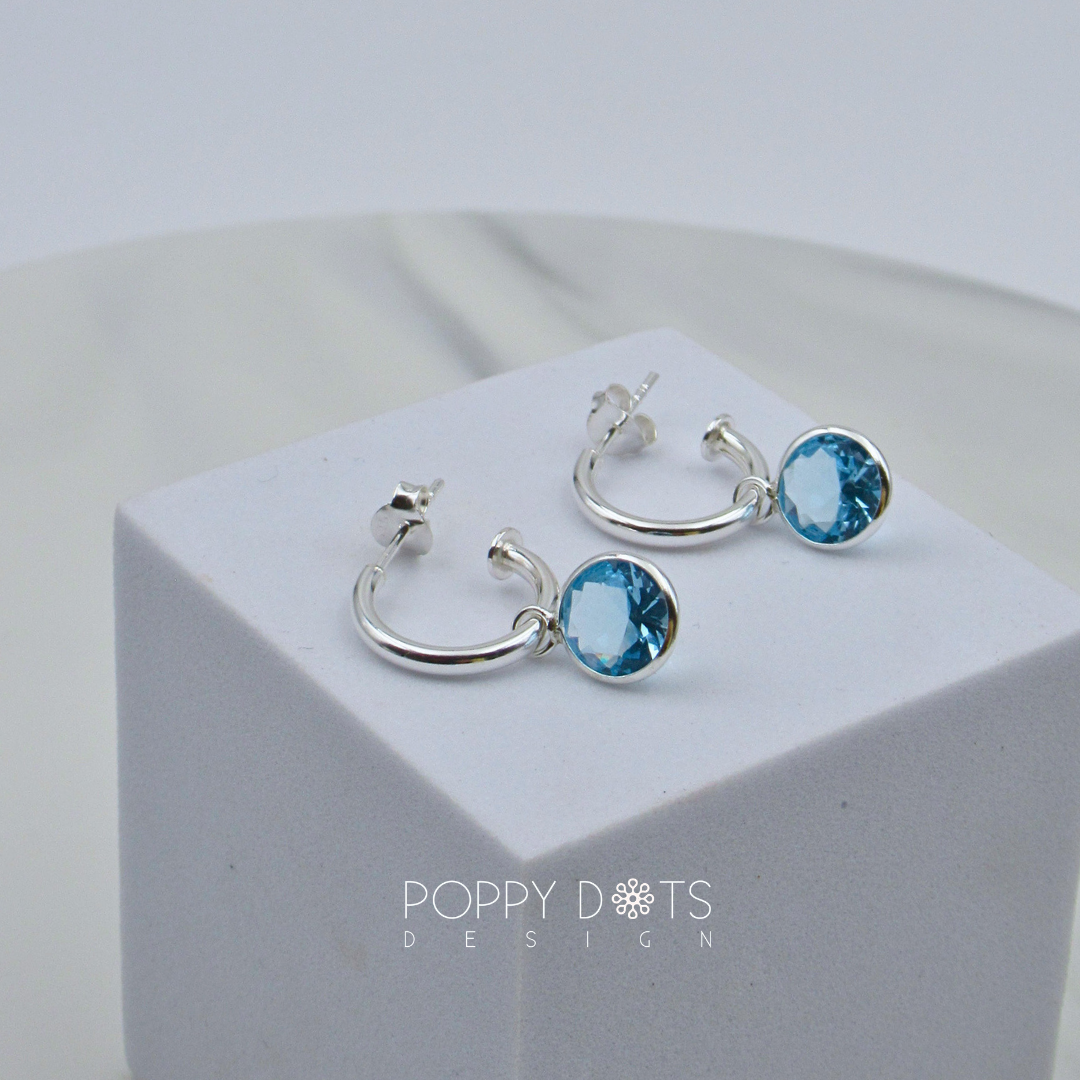 Sterling Silver Pretty Woman Round Light Blue Zirconia Earrings