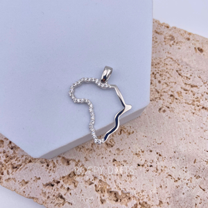 A sterling silver pendant in the shape of the African continent, with one half featuring polished silver and the other half adorned with zirconia stones.