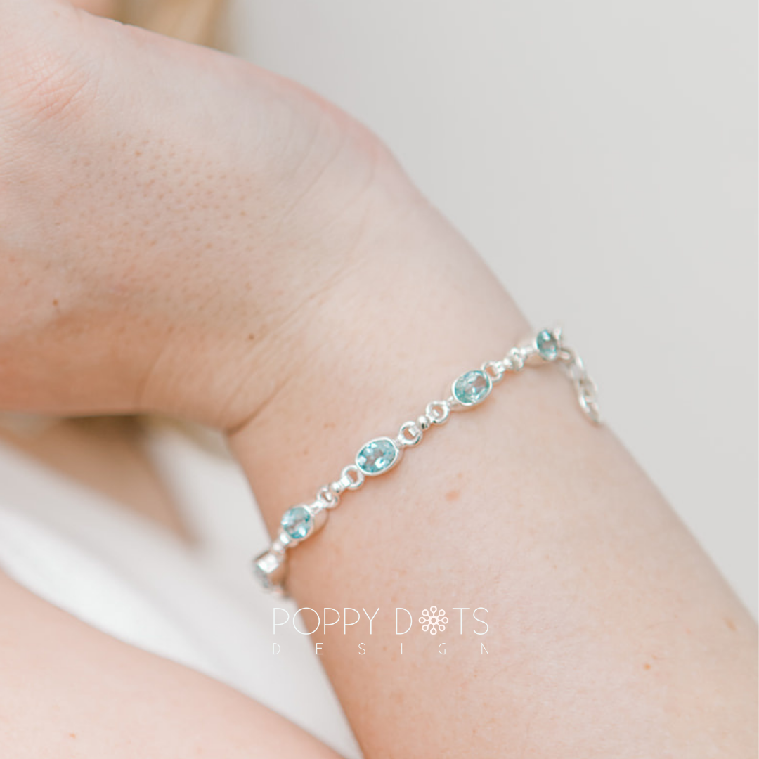 Luxurious Sterling Silver Oval Blue Topaz Bracelet