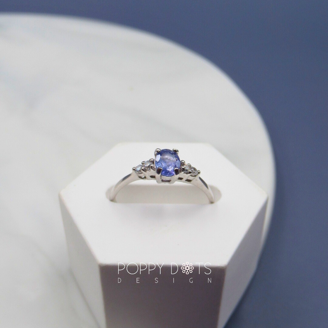 Sterling Silver Oval Tanzanite Ring with Double White Topaz