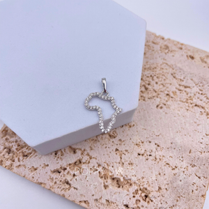 A sterling silver pendant with a shape resembling the continent of Africa, adorned with multiple zirconias, displayed against a neutral background.