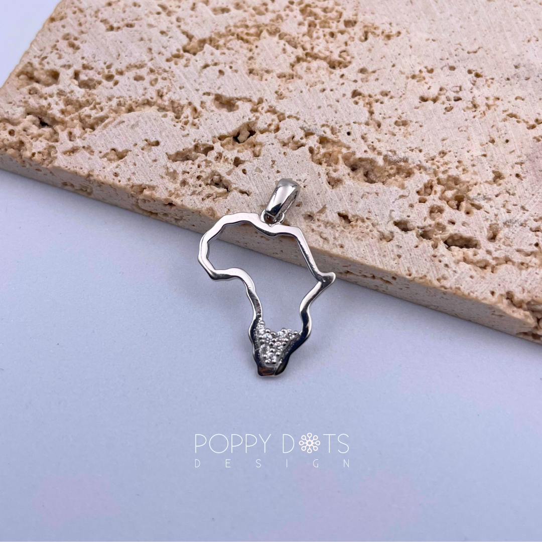 Sterling silver pendant in the shape of Africa with a southern tip featuring zirconias on a textured background.
