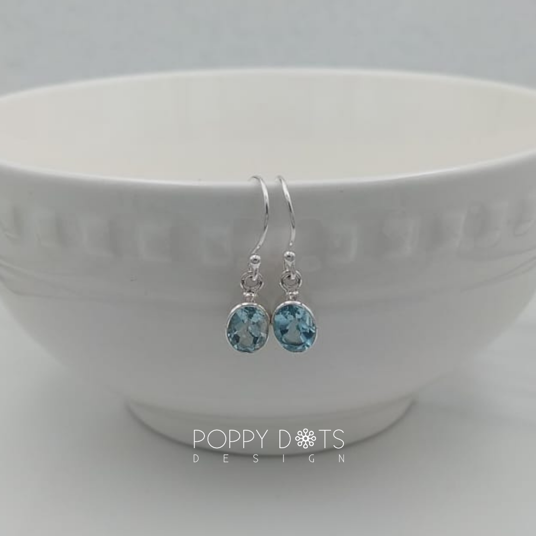 Sterling Silver Blue Topaz Oval Earrings