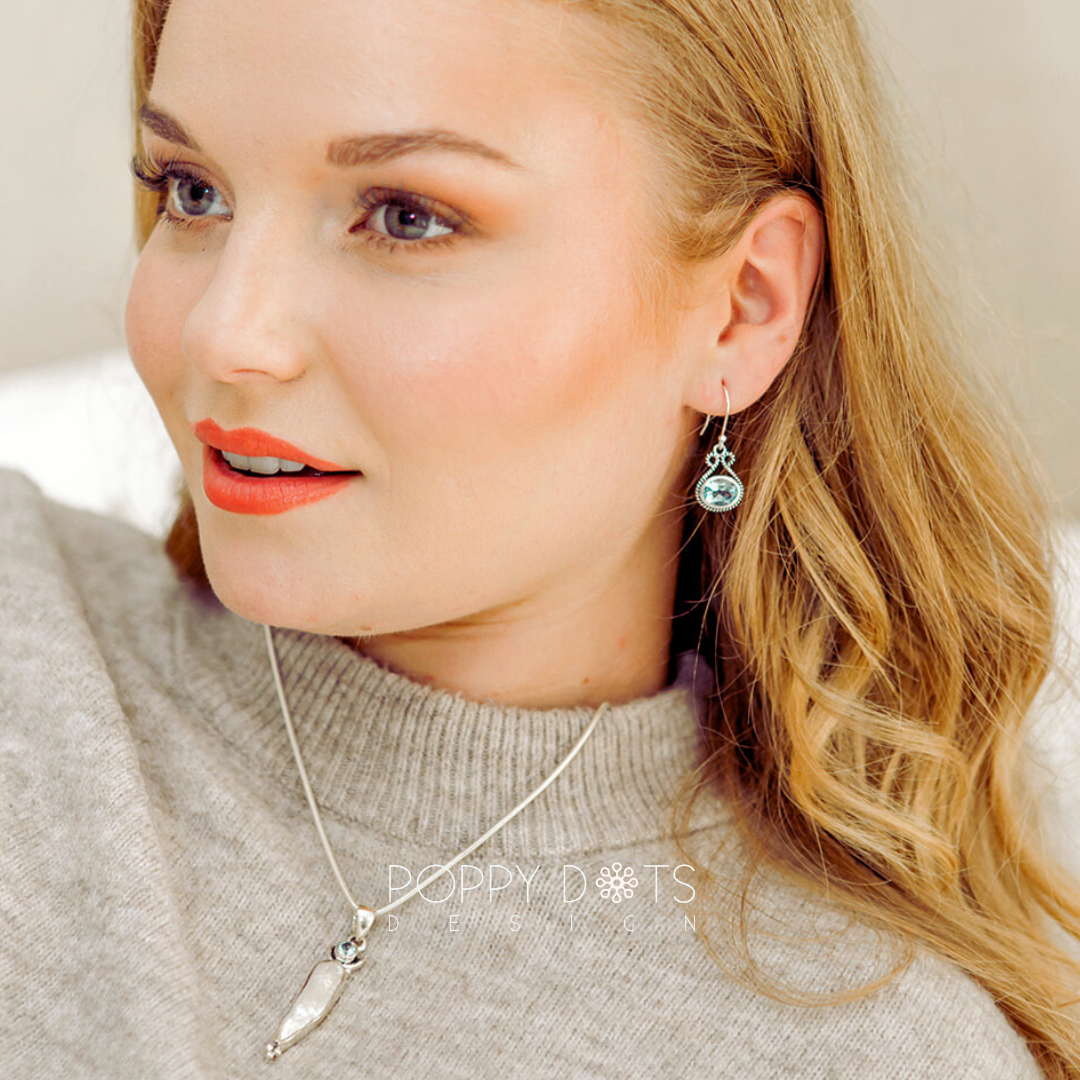 Sterling Silver Bow Blue Topaz Oval Earrings