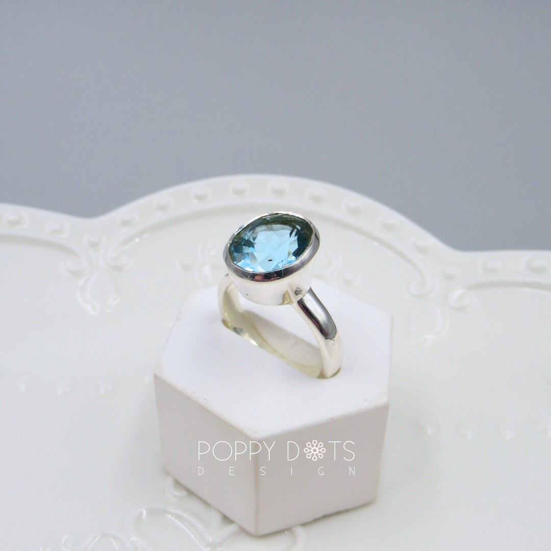 Luxurious Sterling Silver Oval Blue Topaz Ring