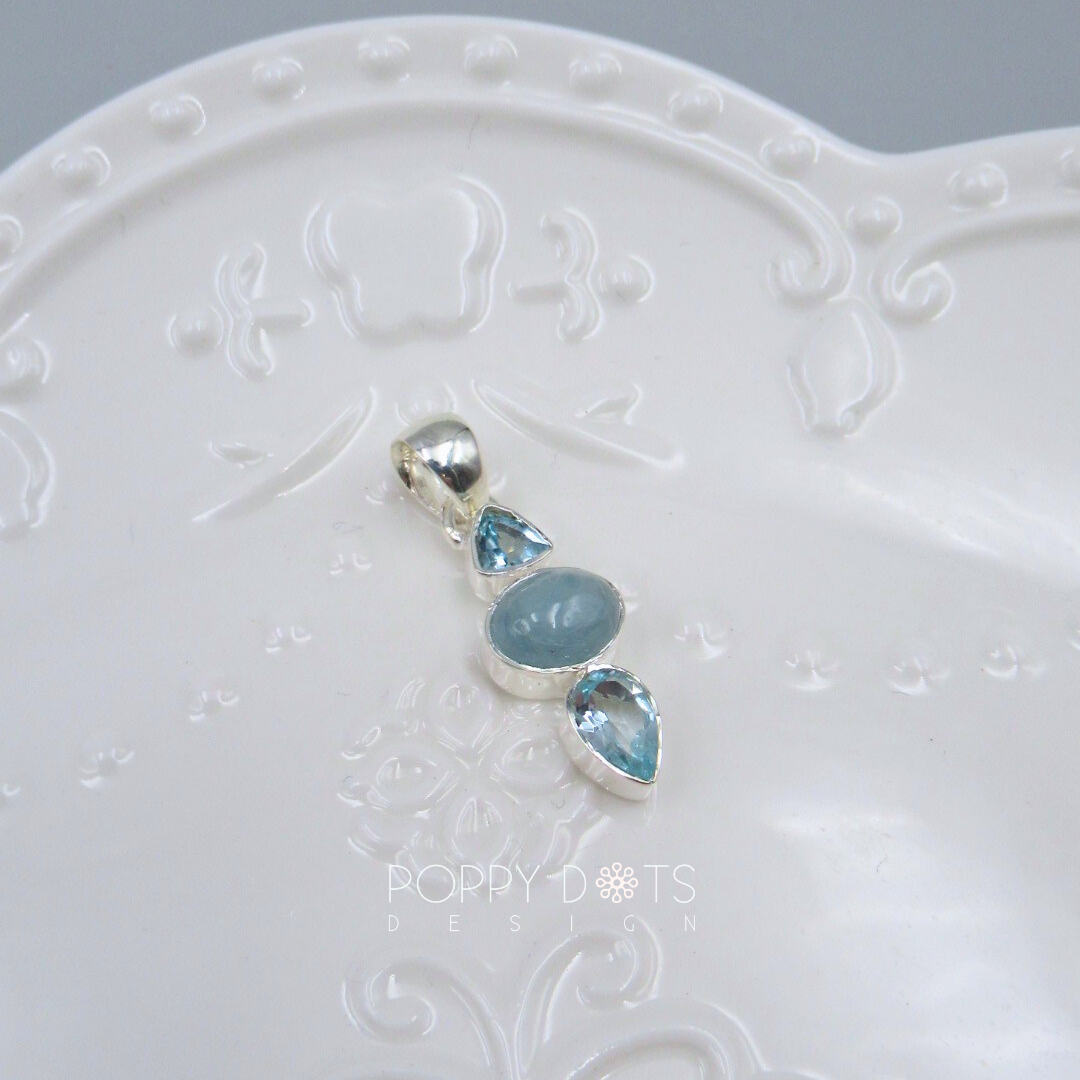 Luxurious Sterling Silver Blue Topaz Earrings and Pendant Set