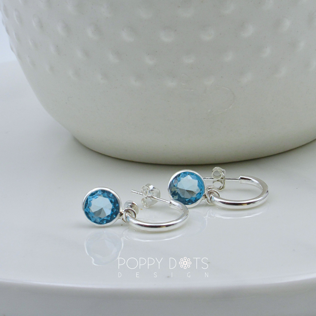Sterling Silver Pretty Woman Round Light Blue Zirconia Earrings